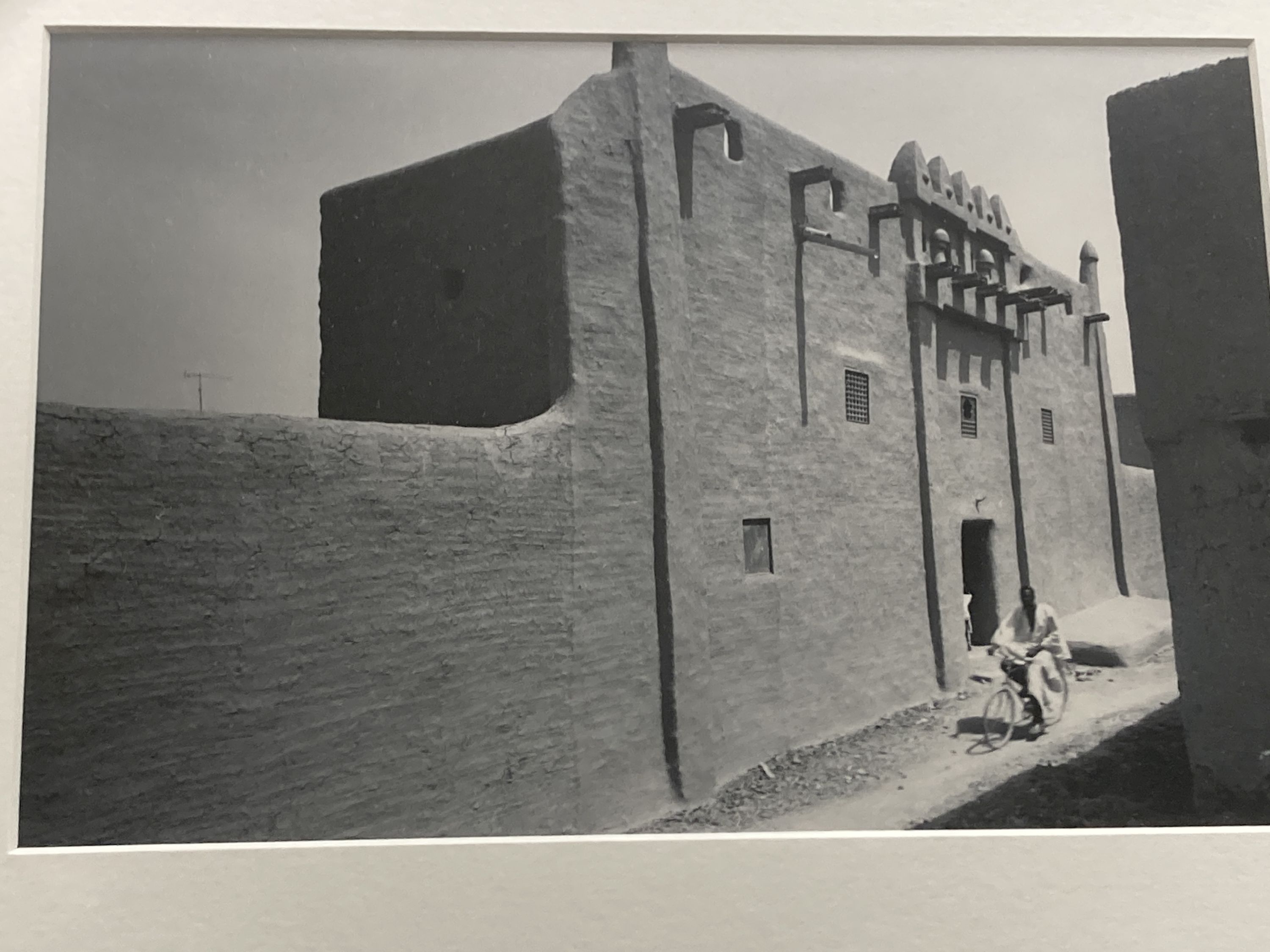 Three framed black and white photographs, North African mosque, Street scene and Fish traps, largest 26 x 17cm